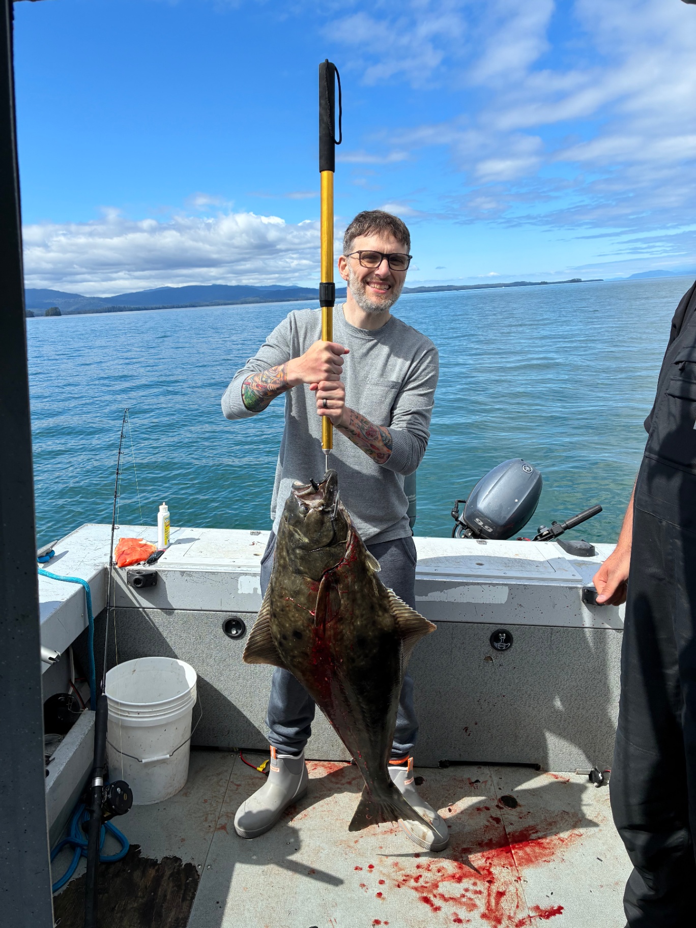 Angler with a big halibut on the boat