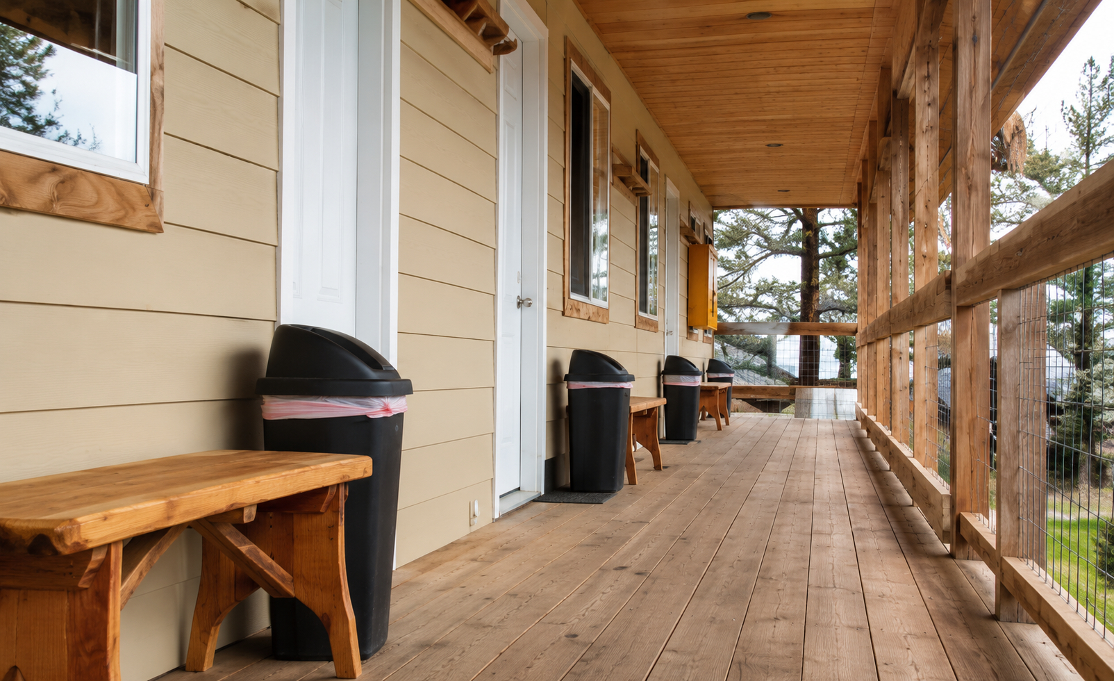 Coffman Cove Lodging guest cabin exterior with covered porch overlooking the harbor in Southeast Alaska