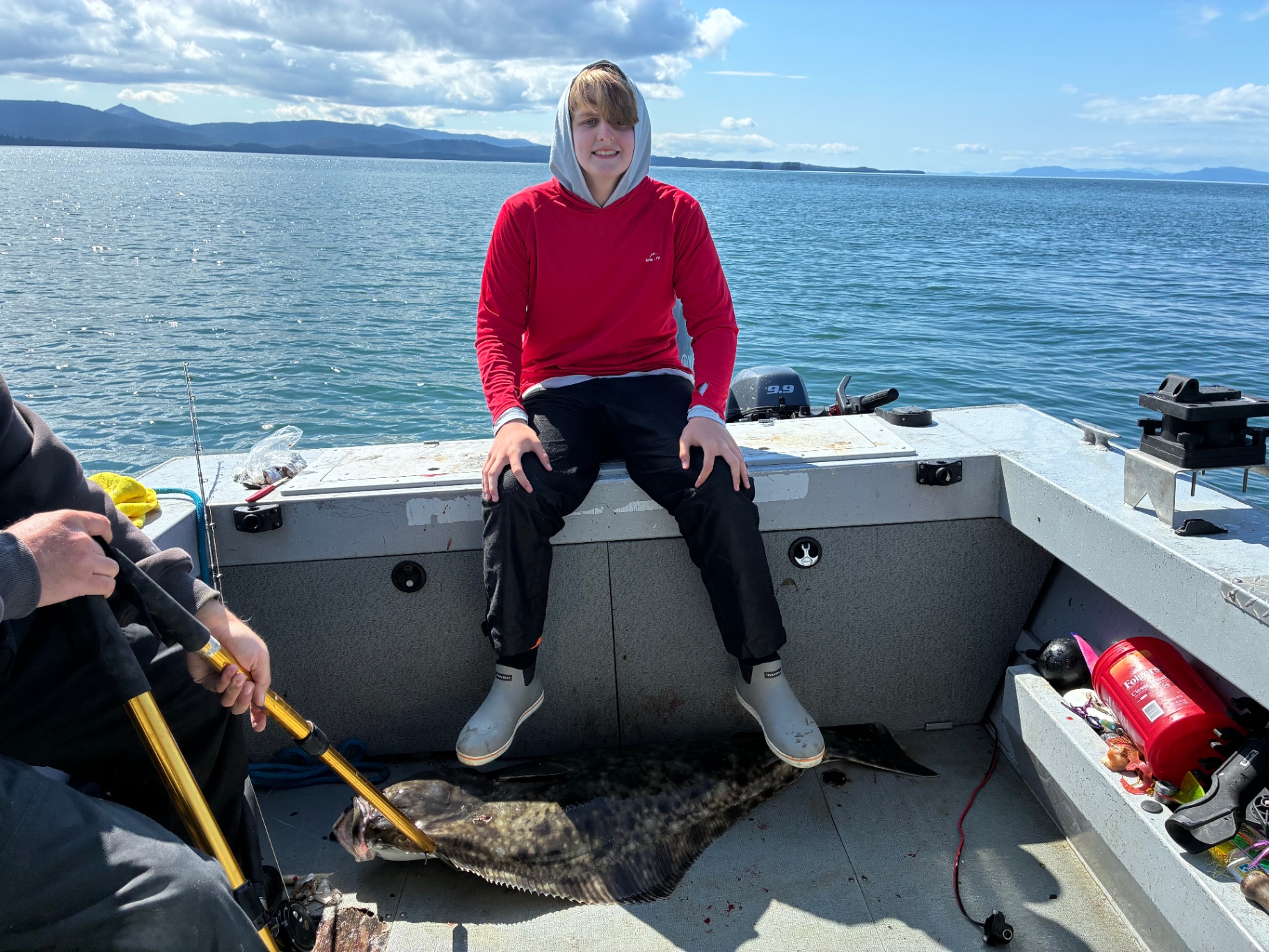 Young angler with a halibut on deck