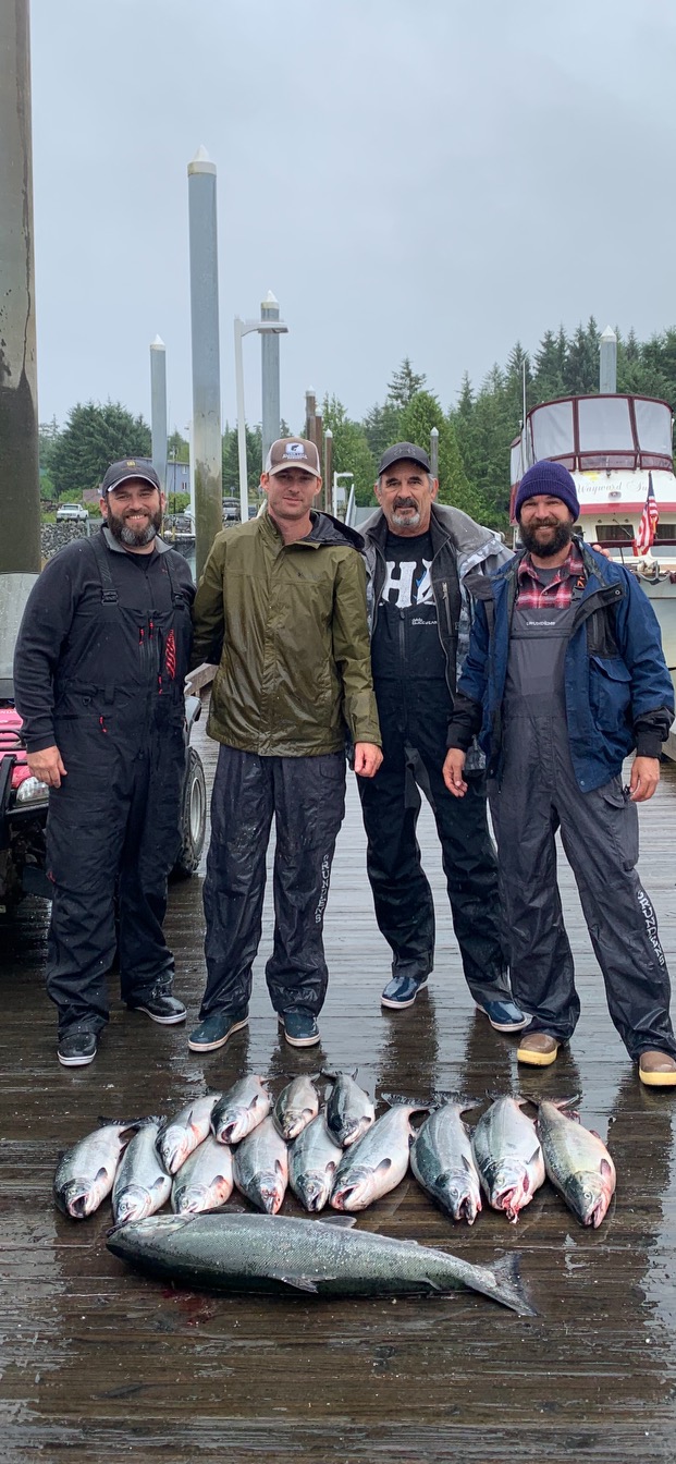 Guests on the dock with the day's limit of salmon